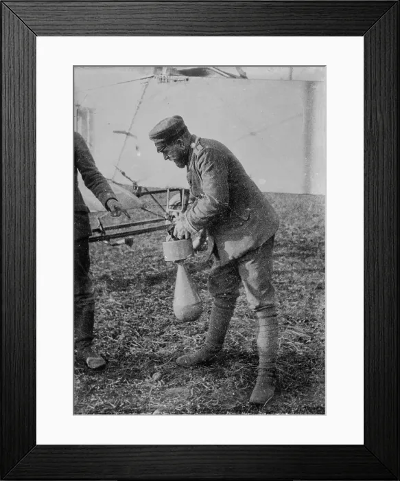 Framed Print : Attaching bomb to German Aeroplane, 16 Jan 1915. Creator: Bain News Service Framed Print : Attaching bomb to German Aeroplane, 16 Jan 1915. Creator: Bain News Service