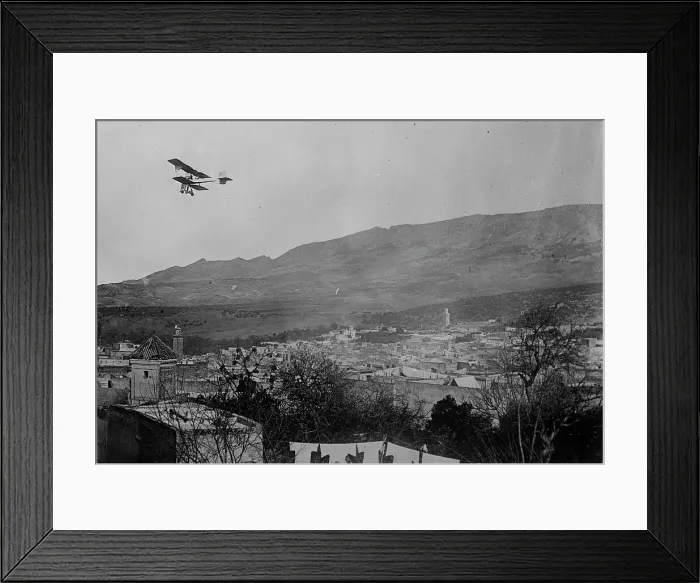 Framed Print : Breguet biplane, type 1910, flying over a town, possibly in Morocco, between c1910 and c1915. Creator: Bain News Service Framed Print : Breguet biplane, type 1910, flying over a town, possibly in Morocco, between c1910 and c1915. Creator: Bain News Service