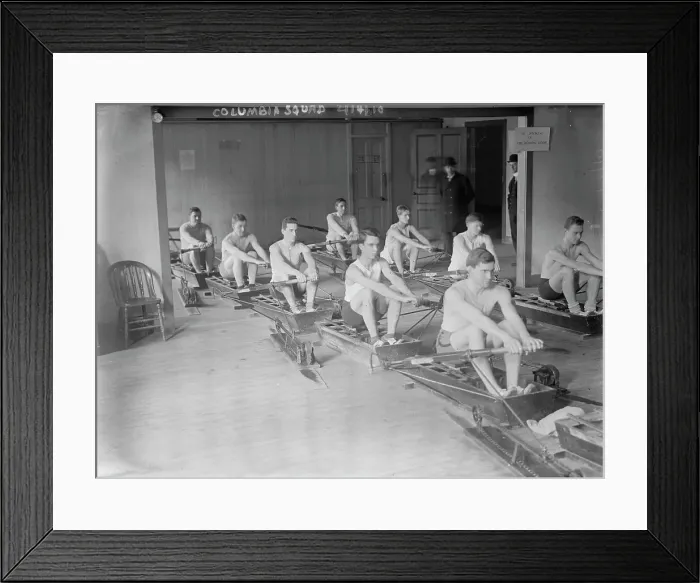 Framed Print : Columbia crew team in mock shells practicing in club house, 1910. Creator: Bain News Service