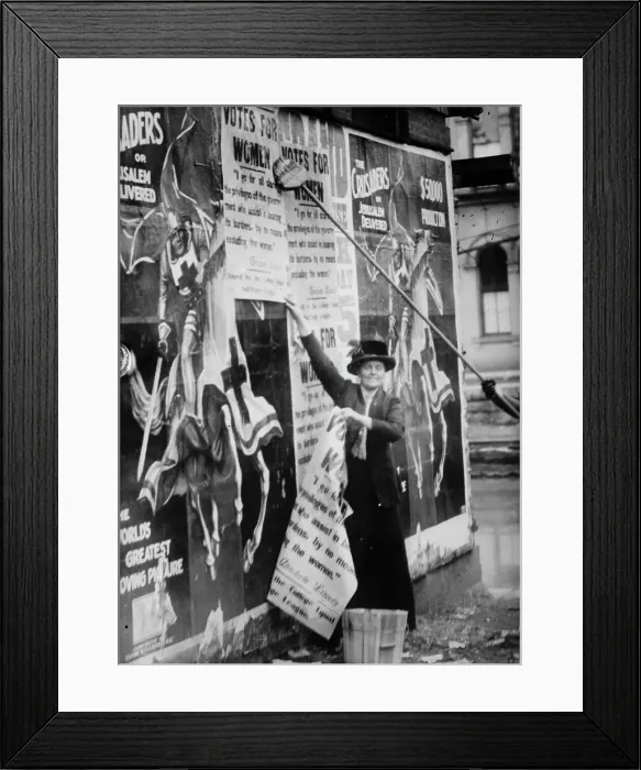 Framed Print : Miss Louise Hall with brush and Susan Fitzgerald assisting bill posting... between c1910 and c1915. Creator: Bain News Service