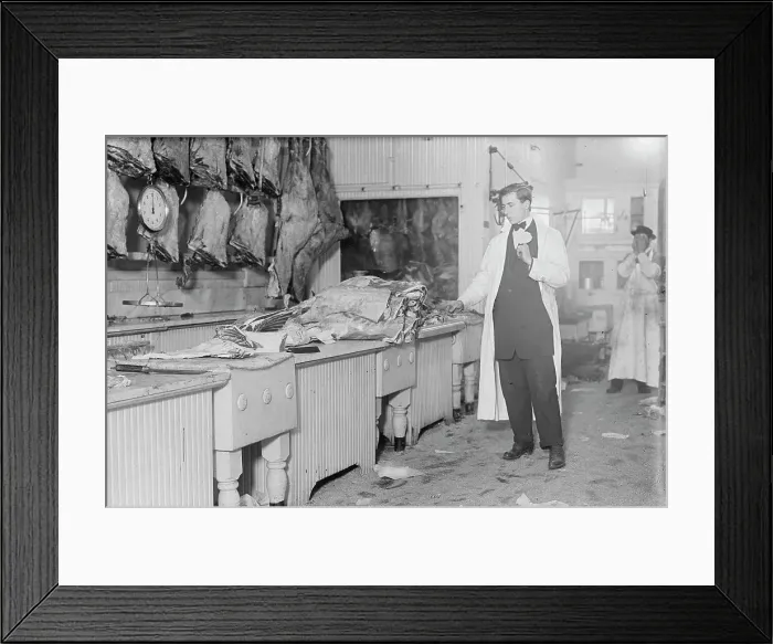 Framed Print : Butcher stands idle before his counter of meat during the meat boycott, 1910. Creator: Bain News Service Framed Print : Butcher stands idle before his counter of meat during the meat boycott, 1910. Creator: Bain News Service