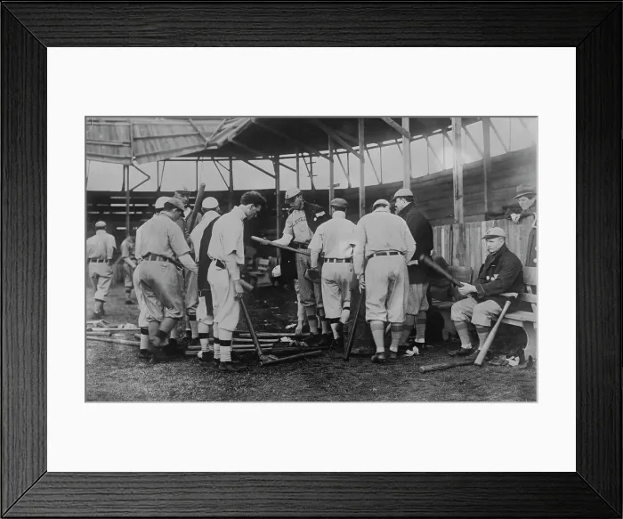 Framed Print : Cleveland [AL] ball players selecting new bats; Graney on bench, 1910. Creator: Bain News Service