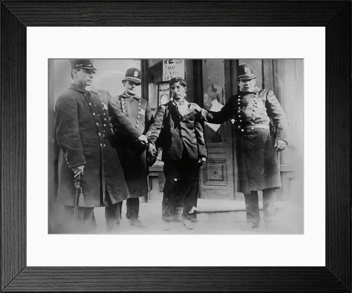 Framed Print : Battered striker with policemen, Philadelphia, 1910. Creator: Bain News Service Framed Print : Battered striker with policemen, Philadelphia, 1910. Creator: Bain News Service