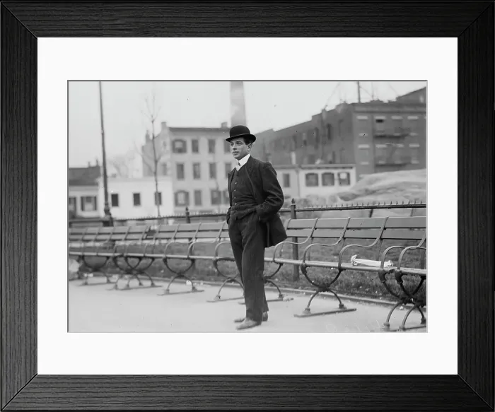 Framed Print : Umberto Blaisie standing in front of park benches, 1910. Creator: Bain News Service Framed Print : Umberto Blaisie standing in front of park benches, 1910. Creator: Bain News Service