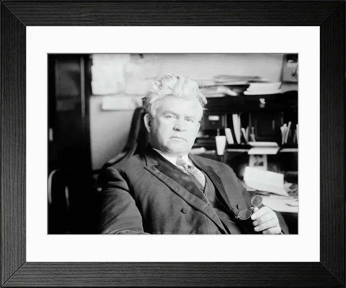 Framed Print : H.T. Rainey, holding bifocals, at desk, 1911. Creator: Bain News Service Framed Print : H.T. Rainey, holding bifocals, at desk, 1911. Creator: Bain News Service