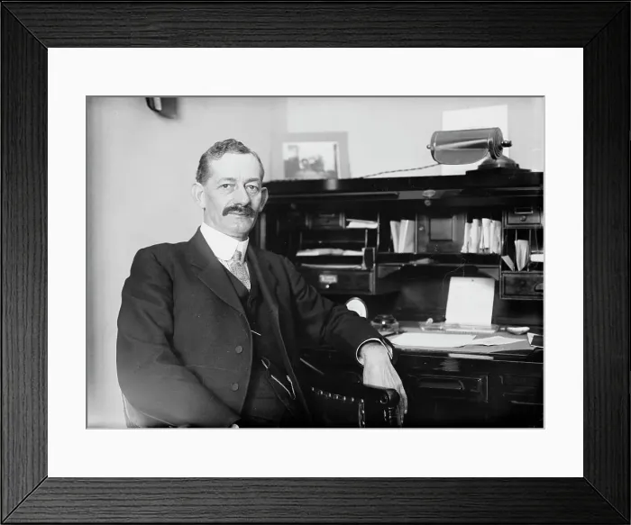 Framed Print : Robt. N. Page seated at desk, 1916. Creator: Bain News Service