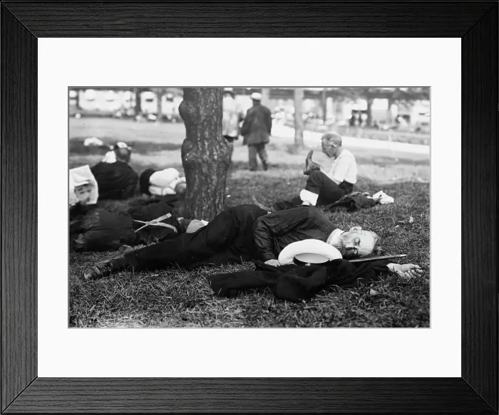 Framed Print : Asleep in Battery Park on hot day, between c1910 and c1915. Creator: Bain News Service Framed Print : Asleep in Battery Park on hot day, between c1910 and c1915. Creator: Bain News Service
