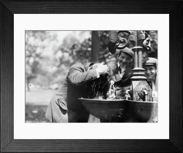 Framed Print : Cooling his head - N.Y. on hot day, between c1910 and c1915. Creator: Bain News Service Framed Print : Cooling his head - N.Y. on hot day, between c1910 and c1915. Creator: Bain News Service