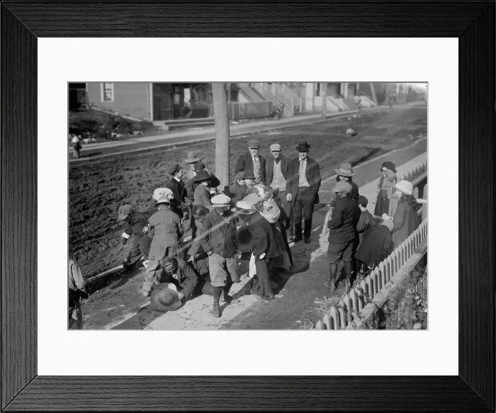 Framed Print : Thanksgiving Maskers scramble for pennies, between c1910 and c1915. Creator: Bain News Service Framed Print : Thanksgiving Maskers scramble for pennies, between c1910 and c1915. Creator: Bain News Service