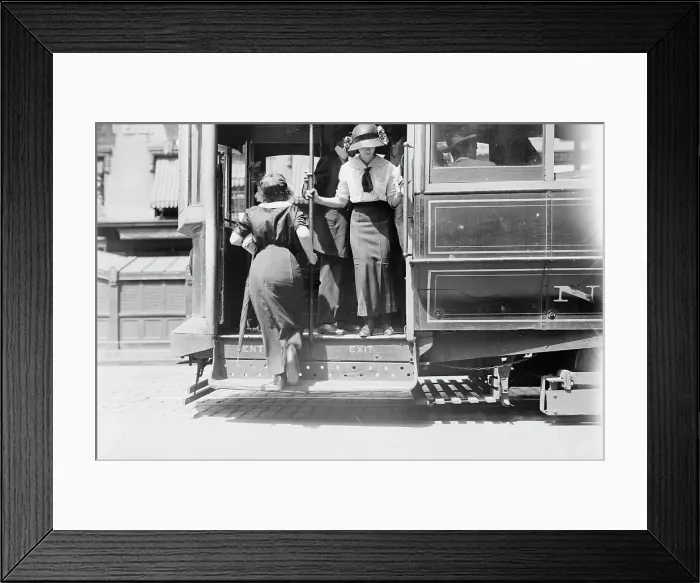 Framed Print : Getting on Brdway car, between c1910 and c1915. Creator: Bain News Service