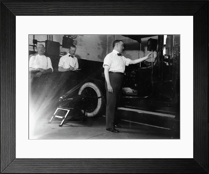 Framed Print : John Drennen inspecting meter, 1913. Creator: Bain News Service Framed Print : John Drennen inspecting meter, 1913. Creator: Bain News Service