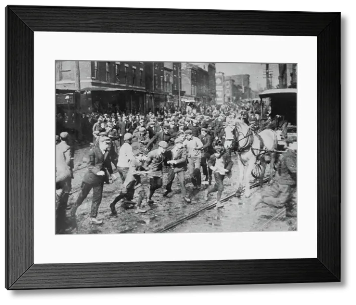 Framed Print : Rioters charging horse-drawn car, later wrecking it on Kensington Ave. Philadelphia, 1910. Creator: Bain News Service Framed Print : Rioters charging horse-drawn car, later wrecking it on Kensington Ave. Philadelphia, 1910. Creator: Bain News Service