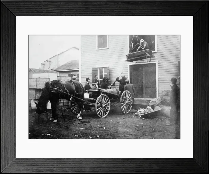 Framed Print : Rimouski - handling coffins of victims, 1914. Creator: Bain News Service Framed Print : Rimouski - handling coffins of victims, 1914. Creator: Bain News Service