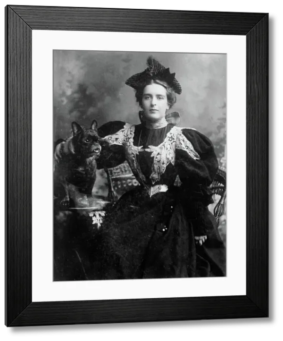 Framed Print : Natalie Barney seated with dog, 1910. Creator: Bain News Service Framed Print : Natalie Barney seated with dog, 1910. Creator: Bain News Service
