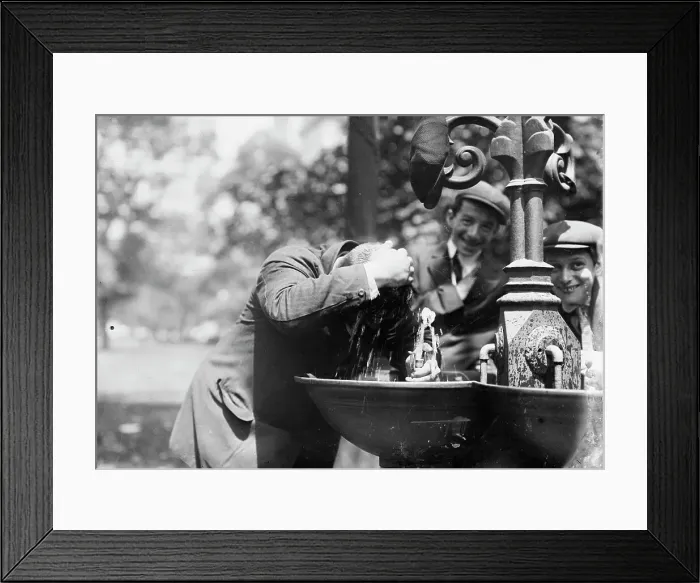 Framed Print : Cooling his head - N.Y. on hot day, between c1910 and c1915. Creator: Bain News Service Framed Print : Cooling his head - N.Y. on hot day, between c1910 and c1915. Creator: Bain News Service