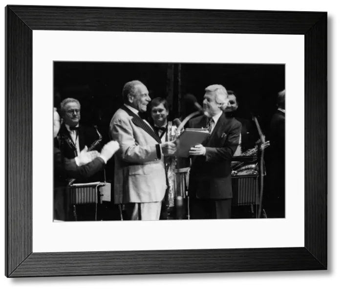 Framed Print : Edmundo Ross and Orchestra, Michael Aspel, 1994. Creator: Brian Foskett Framed Print : Edmundo Ross and Orchestra, Michael Aspel, 1994. Creator: Brian Foskett