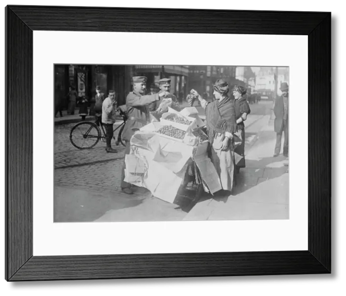 Framed Print : German soldiers buying fruit, Belgium, 1915. Creator: Bain News Service Framed Print : German soldiers buying fruit, Belgium, 1915. Creator: Bain News Service