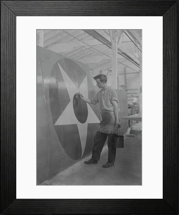 Framed Print : Putting U.S. Emblem on plane, between c1915 and c1920. Creator: Bain News Service Framed Print : Putting U.S. Emblem on plane, between c1915 and c1920. Creator: Bain News Service