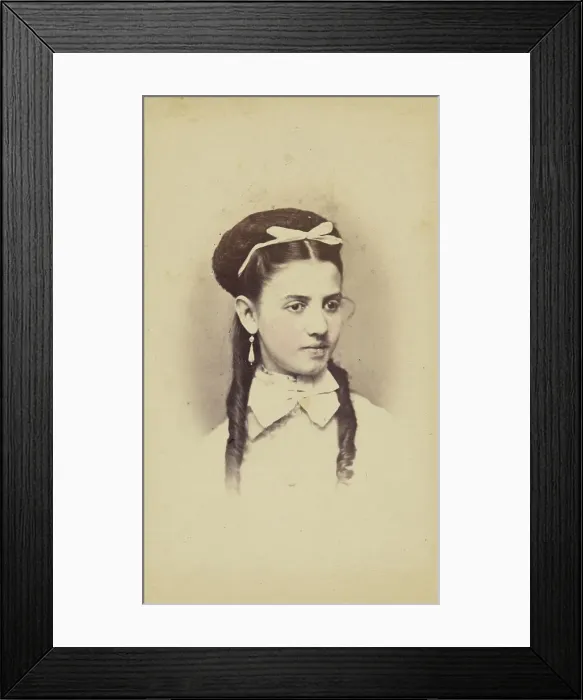 Framed Print : Unidentified young woman with two long curls, wearing a white bow in hair, 1870-1875. Creator: C.L. Lochman Framed Print : Unidentified young woman with two long curls, wearing a white bow in hair, 1870-1875. Creator: C.L. Lochman