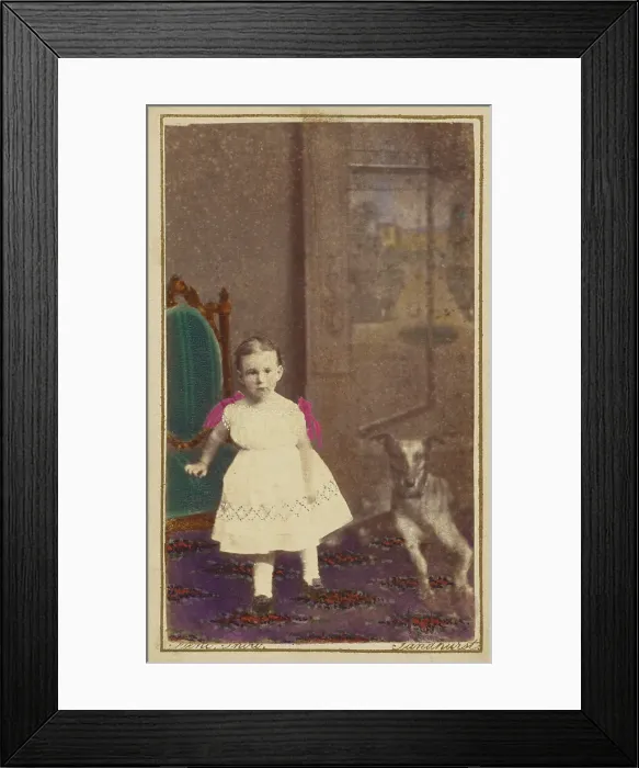 Framed Print : Unidentified little girl standing with a dog on the floor next to her, 1865-1875. Creator: Bent Framed Print : Unidentified little girl standing with a dog on the floor next to her, 1865-1875. Creator: Bent