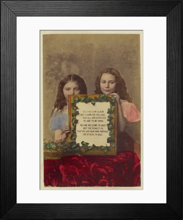 Framed Print : Two unidentified girls holding a framed picture with text, 1870-1875. Creator: Burgwitz & Company Framed Print : Two unidentified girls holding a framed picture with text, 1870-1875. Creator: Burgwitz & Company