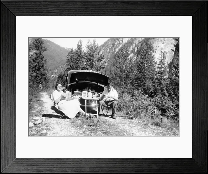 Framed Print : Couple with Vauxhall Wyvern enjoying a picnic, c1950 Framed Print : Couple with Vauxhall Wyvern enjoying a picnic, c1950