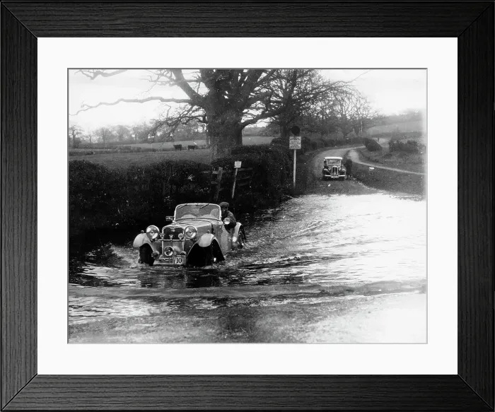 Framed Print : 1935 Singer 1.5 Litre Le Mans taking part in a water splash trial, (1935?) Framed Print : 1935 Singer 1.5 Litre Le Mans taking part in a water splash trial, (1935?)