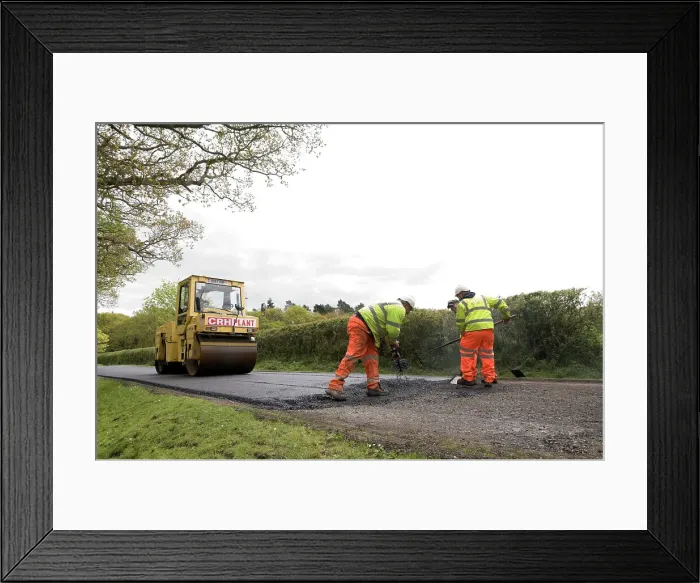 Framed Print : Road resurfacing work repairing potholes Framed Print : Road resurfacing work repairing potholes