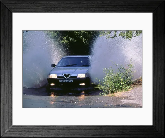 Framed Print : 1989 Alfa Romeo 164 driving through a ford Framed Print : 1989 Alfa Romeo 164 driving through a ford