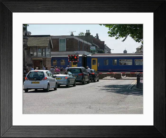 Framed Print : Train passing through level crossing in Lincoln 2014