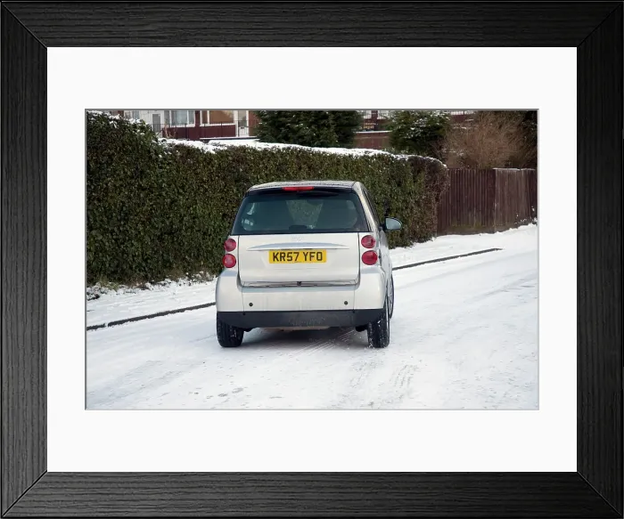 Framed Print : 2007 Smart car sliding on snowy road Framed Print : 2007 Smart car sliding on snowy road