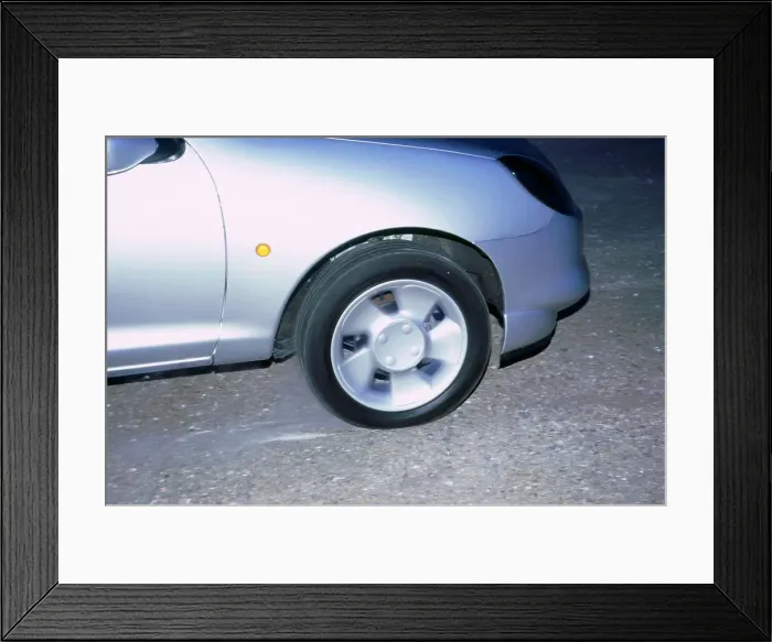 Framed Print : Wheel spin on 1998 Ford Puma producing smoke Framed Print : Wheel spin on 1998 Ford Puma producing smoke