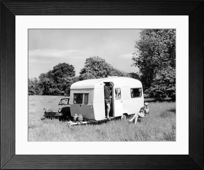 Framed Print : Couple on holiday with their 1963 Sprite Alpine caravan, (c1963?) Framed Print : Couple on holiday with their 1963 Sprite Alpine caravan, (c1963?)