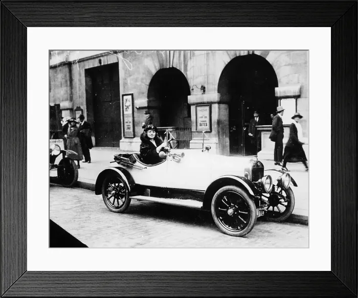 Framed Print : Miss Evelyn Laye sitting in a parked car, (1920s?) Framed Print : Miss Evelyn Laye sitting in a parked car, (1920s?)