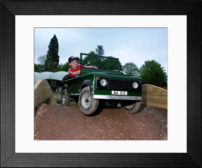 Framed Print : Child driving a toy Land Rover Framed Print : Child driving a toy Land Rover