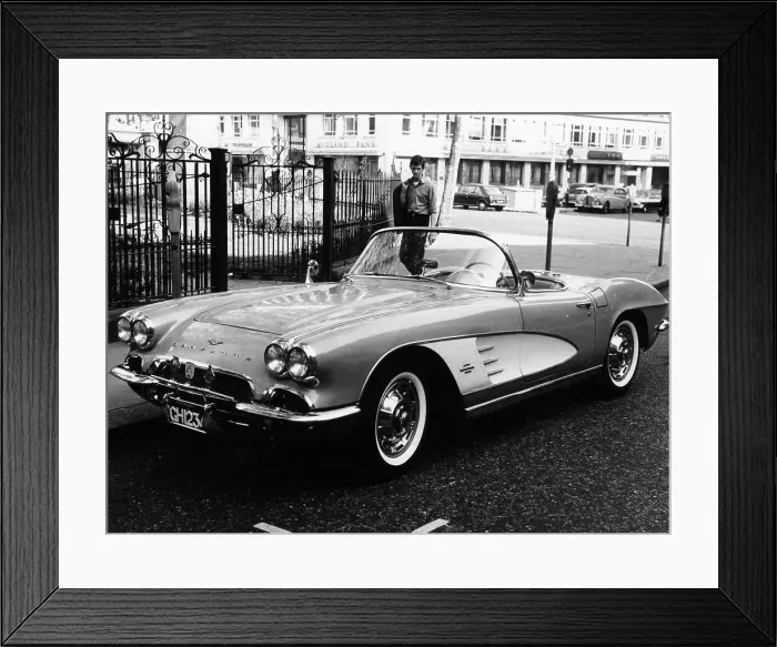 Framed Print : 1961 Chevrolet Corvette on a parking meter, (c1961?) Framed Print : 1961 Chevrolet Corvette on a parking meter, (c1961?)