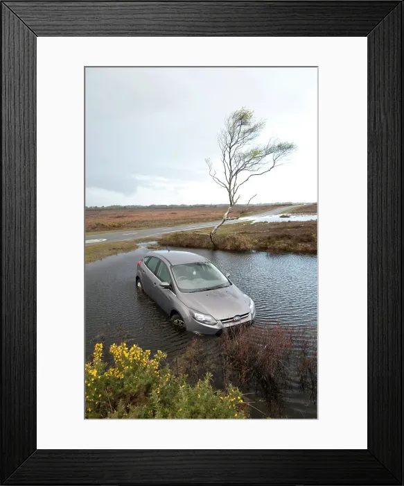 Framed Print : Ford Focus in flooded ditch after losing control on wet road 2012 Framed Print : Ford Focus in flooded ditch after losing control on wet road 2012