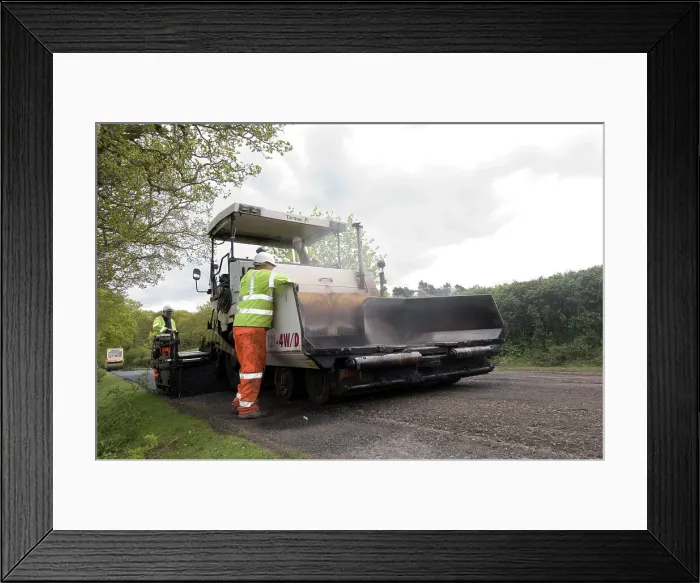 Framed Print : Road resurfacing work repairing potholes Framed Print : Road resurfacing work repairing potholes