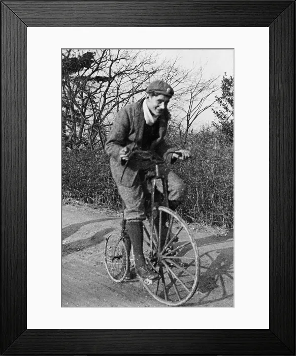 Framed Print : A young Lord Nuffield riding a bicycle down a country lane Framed Print : A young Lord Nuffield riding a bicycle down a country lane