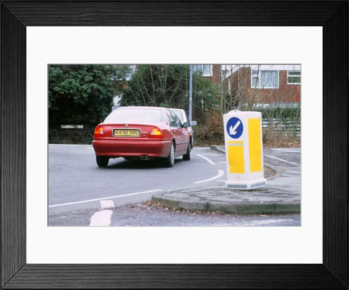 Framed Print : Keep left bollard.Road junction Framed Print : Keep left bollard.Road junction