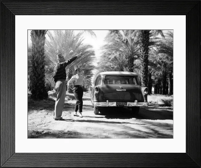 Framed Print : Couple with a 1955 Chevrolet Townsman station wagon, (c1955?) Framed Print : Couple with a 1955 Chevrolet Townsman station wagon, (c1955?)