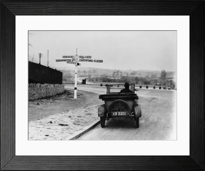 Framed Print : Car near a road sign, Bromley, Kent, 1920s Framed Print : Car near a road sign, Bromley, Kent, 1920s