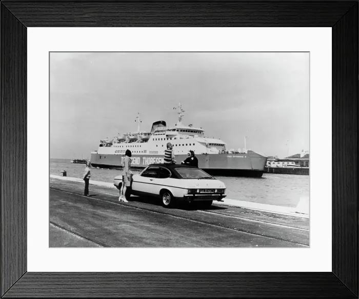Framed Print : A 1974 Ford Capri on a quay, in front of a Townsend Thoresen car ferry, 1970s Framed Print : A 1974 Ford Capri on a quay, in front of a Townsend Thoresen car ferry, 1970s