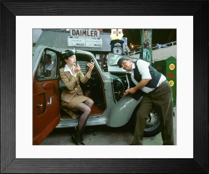 Framed Print : Mechanic with lady driver doing her make up, 1930's Hillman Minx Framed Print : Mechanic with lady driver doing her make up, 1930's Hillman Minx