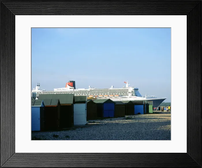 Framed Print : Queen Mary II sails past Beach Huts, Calshot May 2004 Framed Print : Queen Mary II sails past Beach Huts, Calshot May 2004