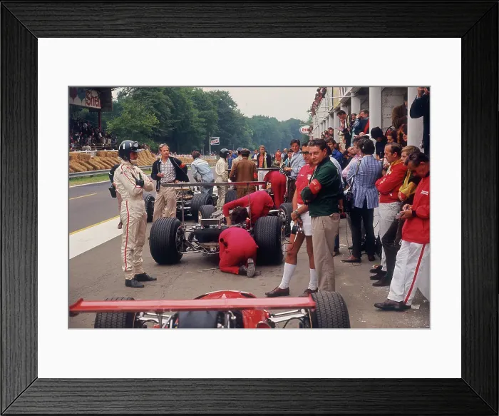 Framed Print : Graham Hill watches Mechanics working on a car, French Grand Prix, Rouen, 1968 Framed Print : Graham Hill watches Mechanics working on a car, French Grand Prix, Rouen, 1968