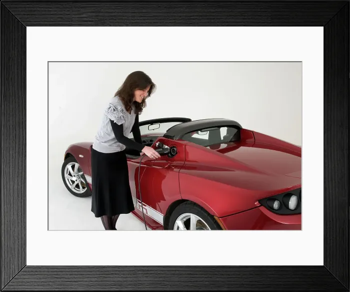 Framed Print : 2010 Tesla Roadster electric car being re charged Framed Print : 2010 Tesla Roadster electric car being re charged