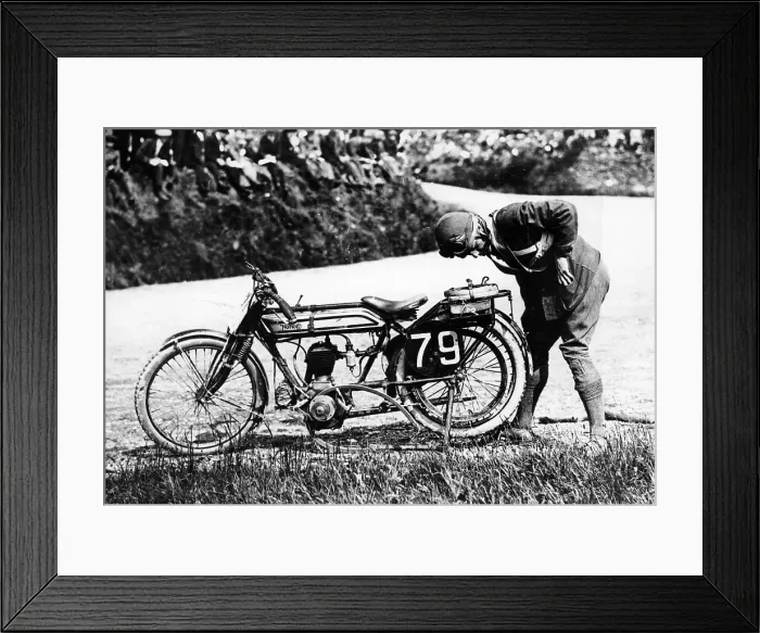 Framed Print : Norman Black repairing a punture on his Norton bike, 1920 Framed Print : Norman Black repairing a punture on his Norton bike, 1920