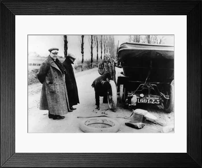 Framed Print : Lord Northcliffe's chauffeur changing a tyre, (c1908?) Framed Print : Lord Northcliffe's chauffeur changing a tyre, (c1908?)