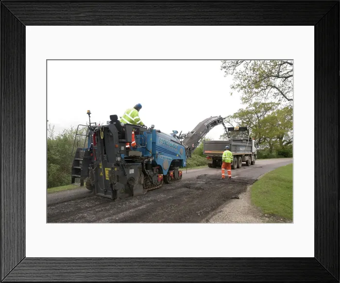 Framed Print : Road resurfacing work repairing potholes